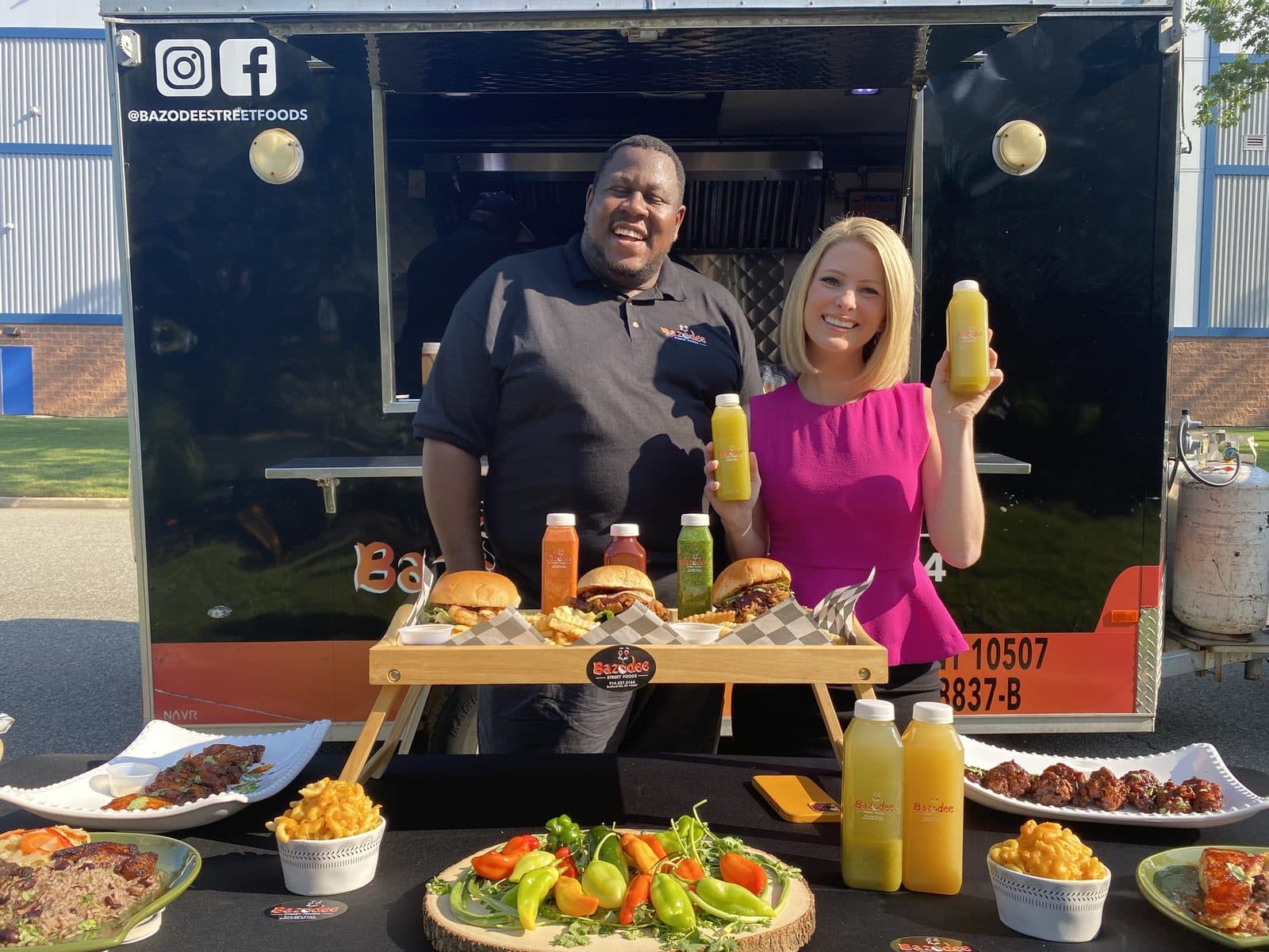 The Bazodee Street Foods truck at an event, with a spread of burgers, fries, and drinks